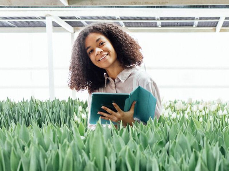 Woman in greenhouse