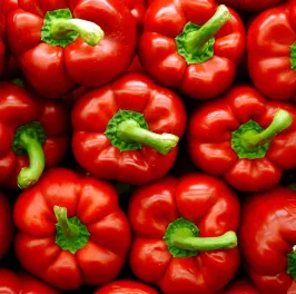 Vibrant stack of red peppers