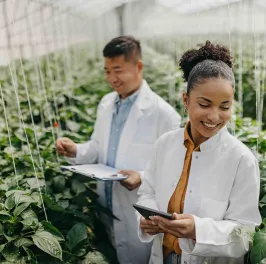 DEI-two-scientists-in-greenhouse