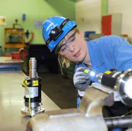 Woman operating machinery