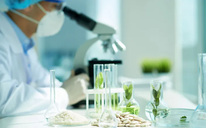 Plant biologist at work in lab