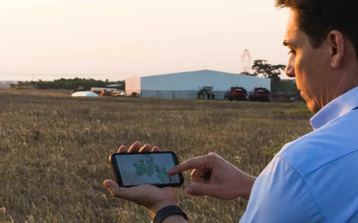 Farmer using technology in the field